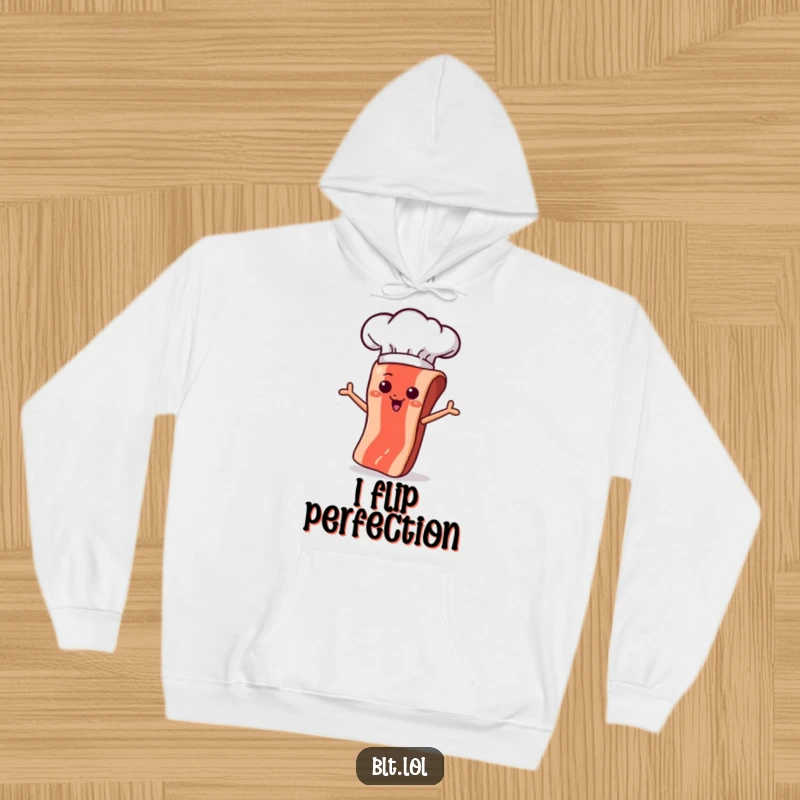Funny bacon strip wearing a chef hat, performing a perfect flip in a pan, on a comfortable hoodie.
