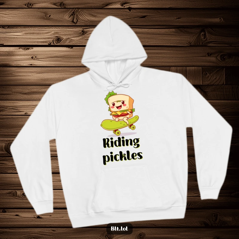 Soft hoodie featuring a funny BLT sandwich character smiling while skateboarding on a giant pickle.